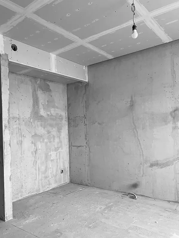Hotel Marriott residence apartment under renovation in Batumi, empty room with drywall ceiling and unfinished concrete walls