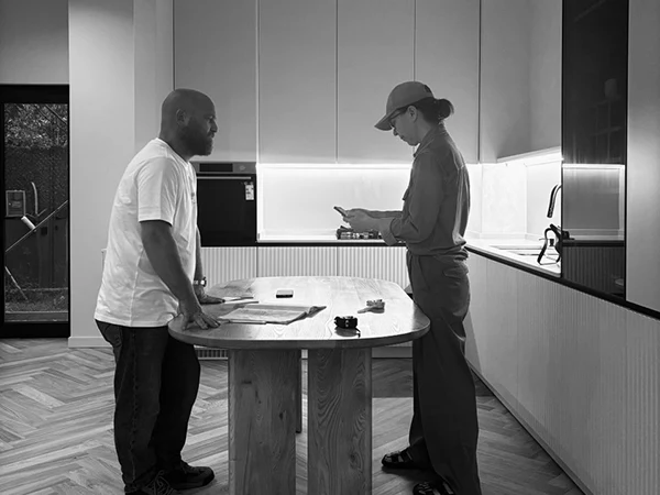 Natallia Klimovich and Daria Ipatieva, founders of Arcus, standing inside a renovation project apartment