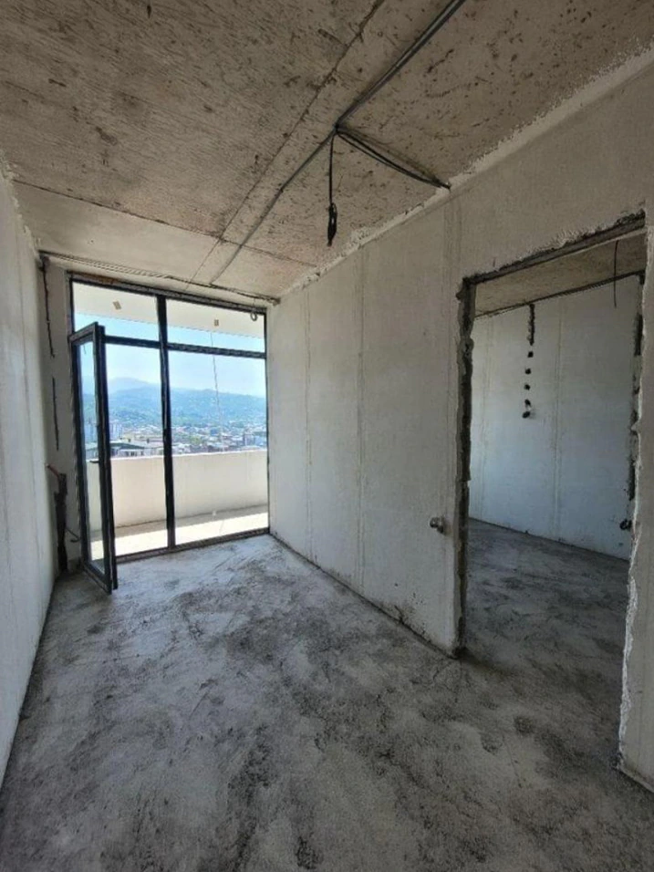 Unfinished living area in a 46 m² Accent apartment with access to a private balcony