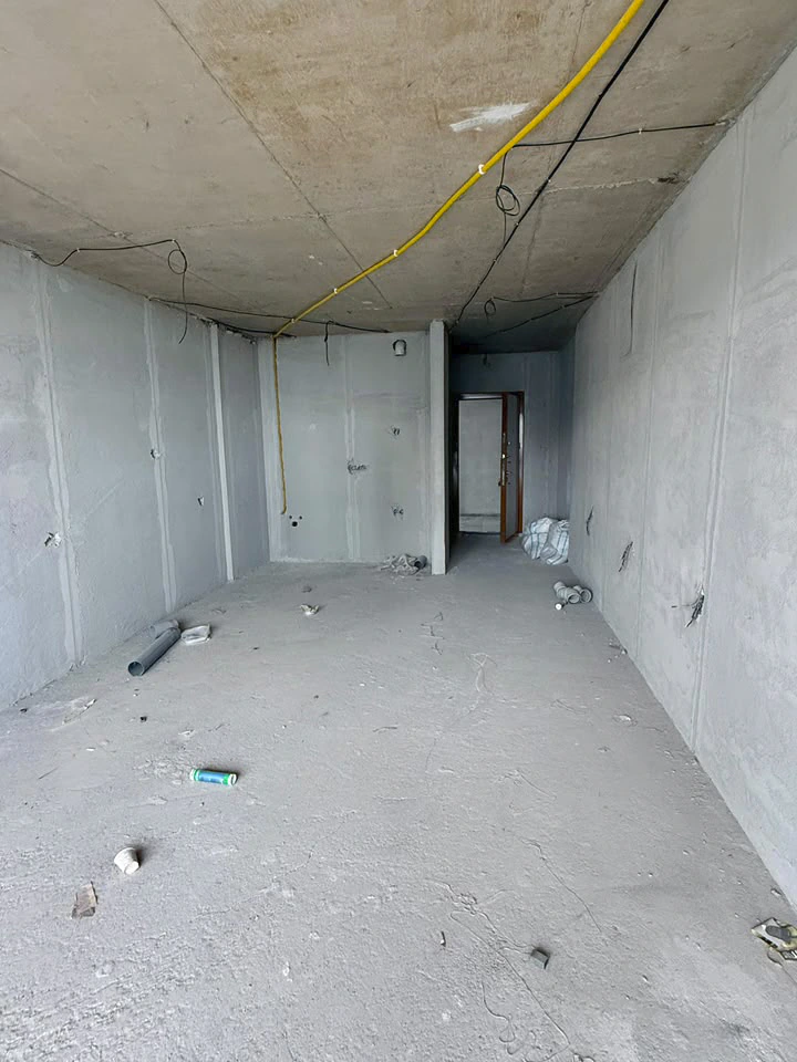 Unfinished studio viewed from the balcony side towards the entrance hallway