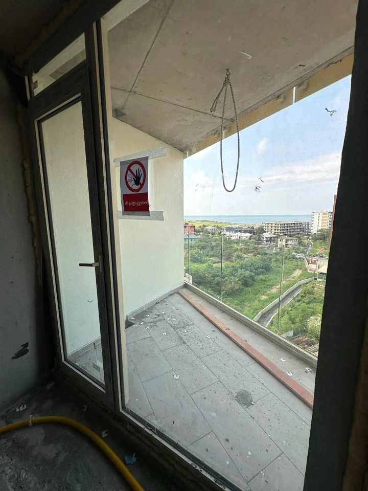 Unfinished balcony with side sea view in Optima Residence