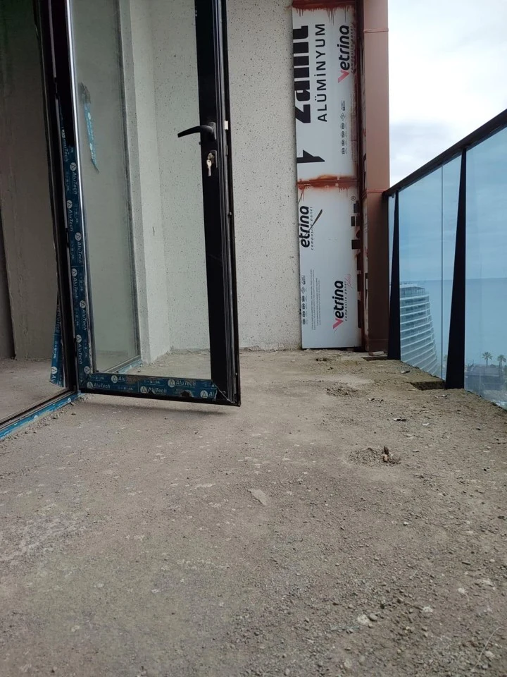 Apartment balcony with glass railing in Ande Tower 2