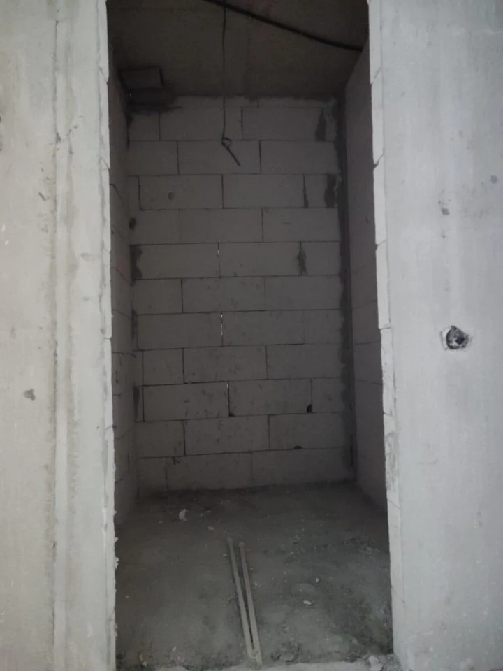 Unfinished bathroom in the white-frame apartment