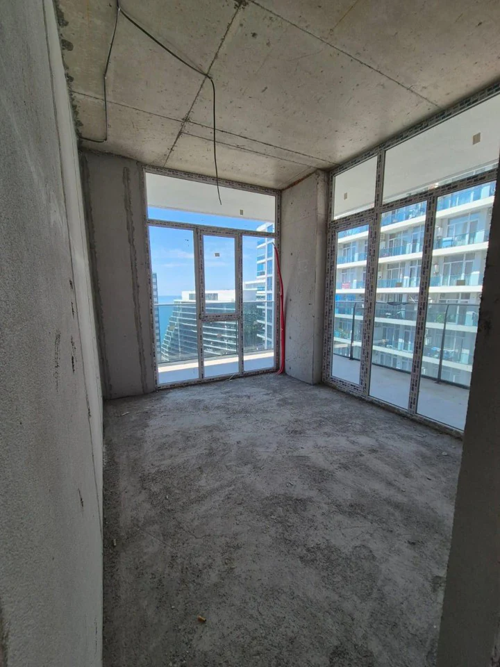Corner room with panoramic windows and partial sea view