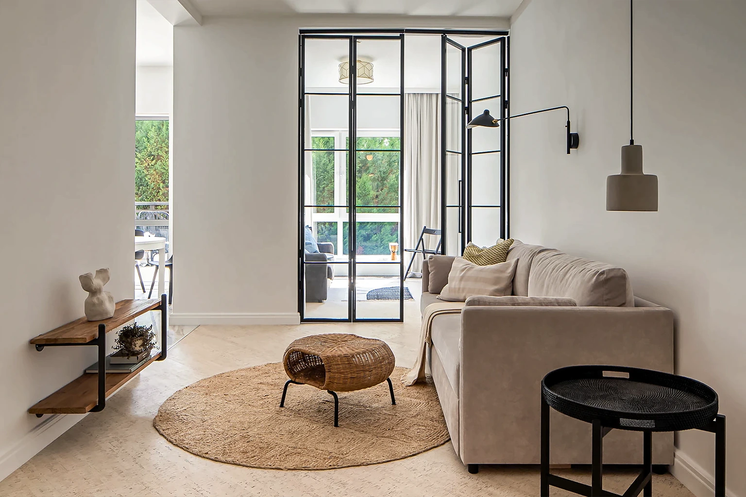 Cozy living room with black-framed glass partition