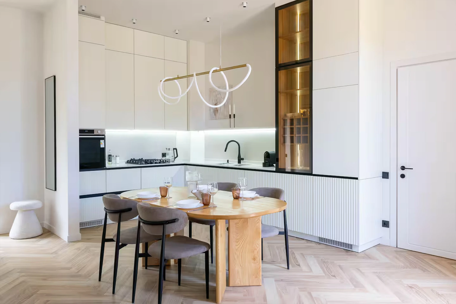 Modern kitchen and dining area with custom cabinetry