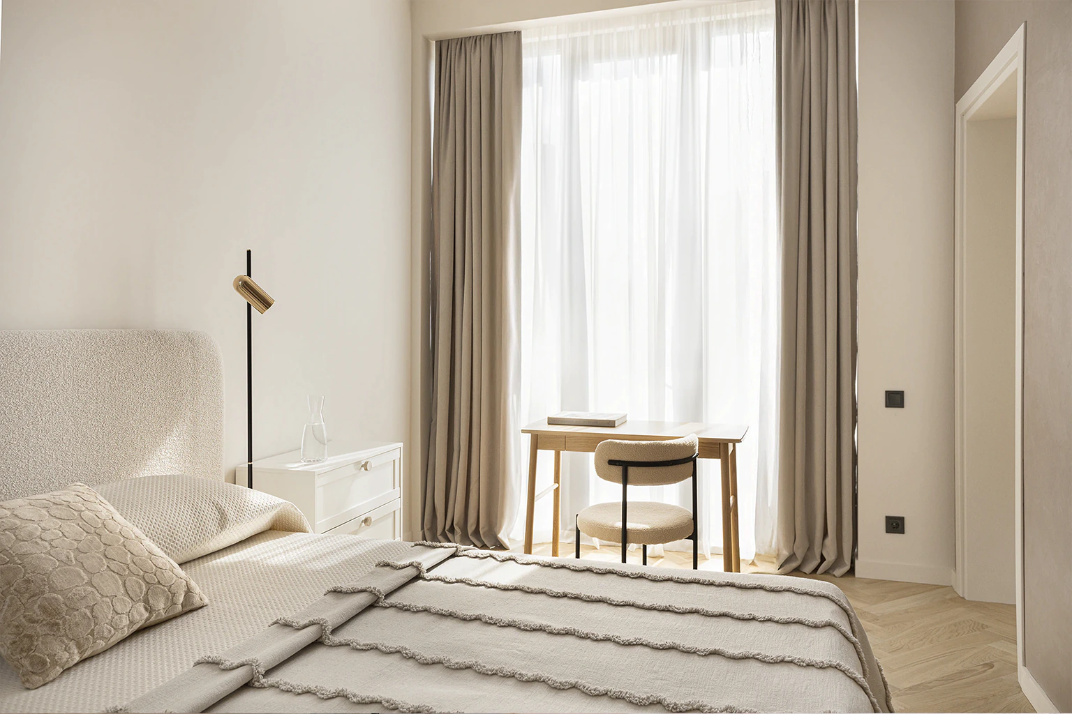 Minimal bedroom with desk and floor-to-ceiling window