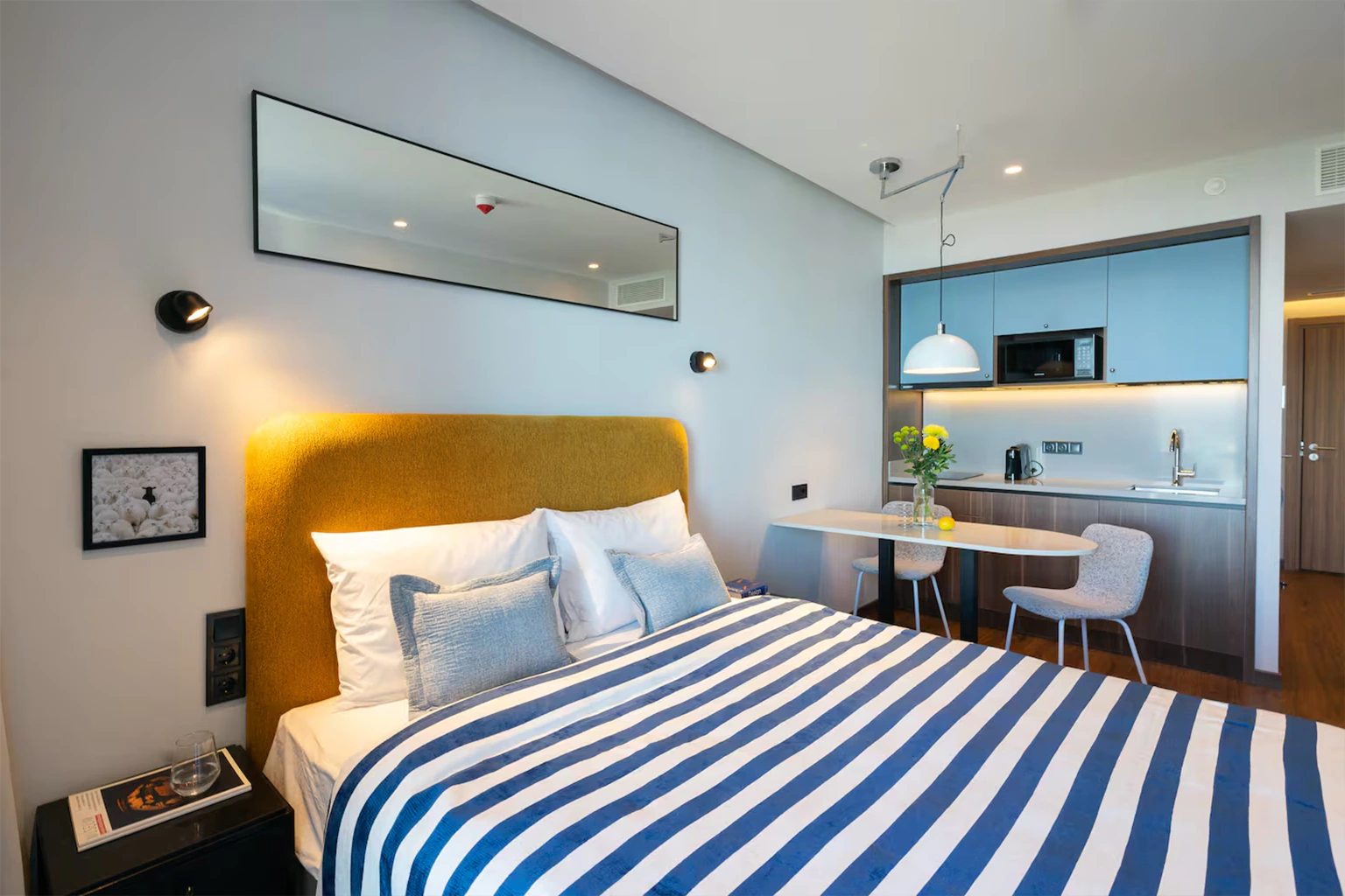 Studio bedroom with kitchenette and dining area