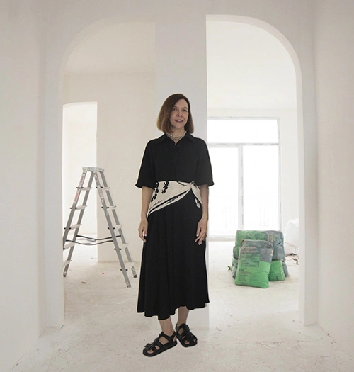 Founders of Arcus standing in a renovation project apartment during the early construction phase
